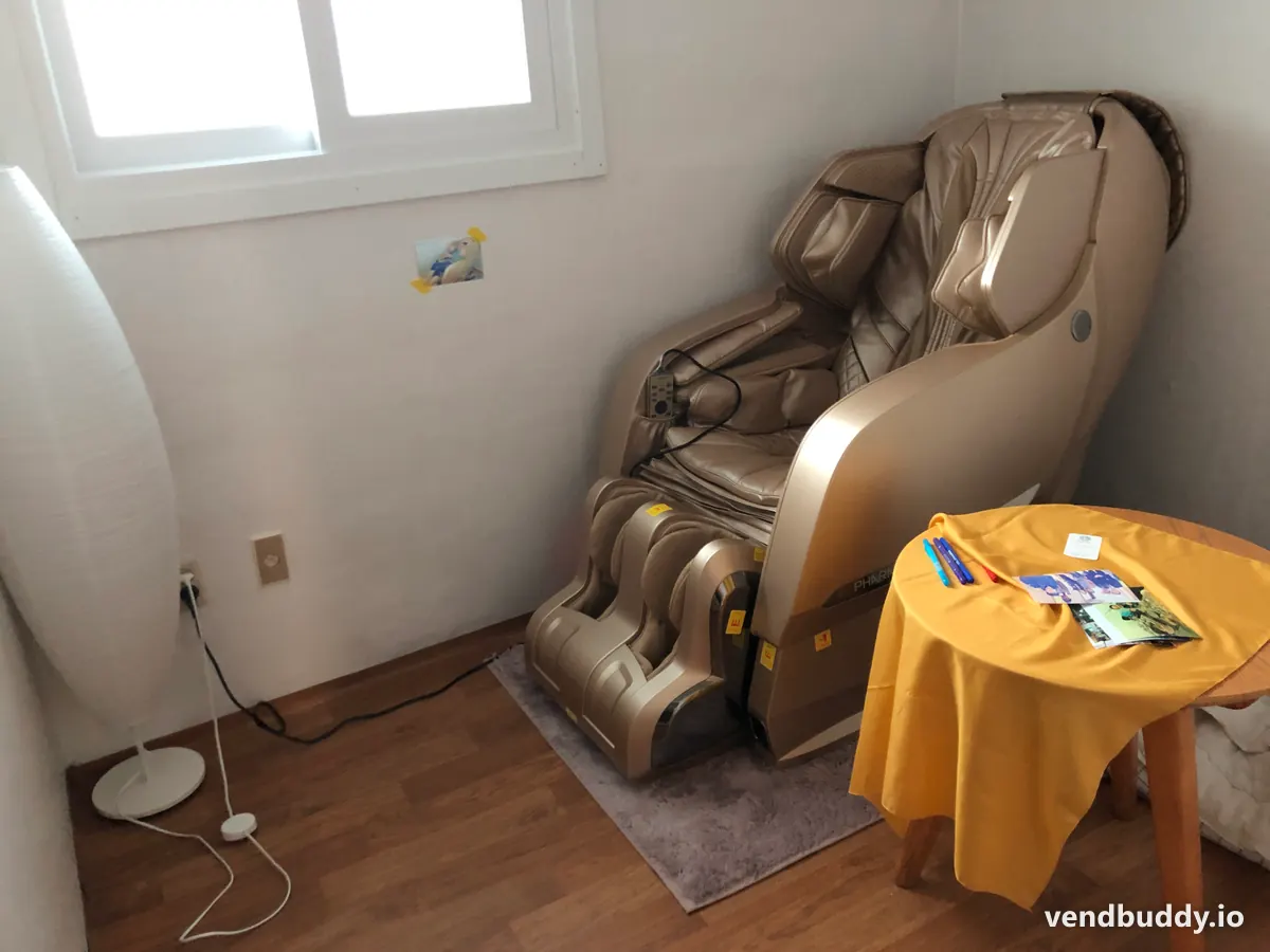 A full-body massage chair with leg and arm rollers, the kind of unit a massage chair vending business places in a venue